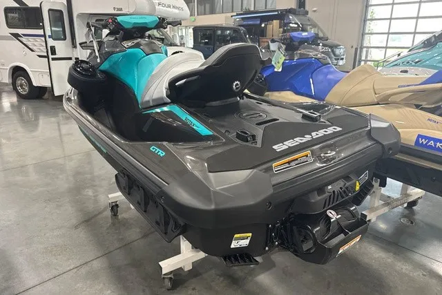 Slide: The Image of A 2026 Sea-Doo PWC GTR 230 in a showroom. It features a sleek, modern design. - 5