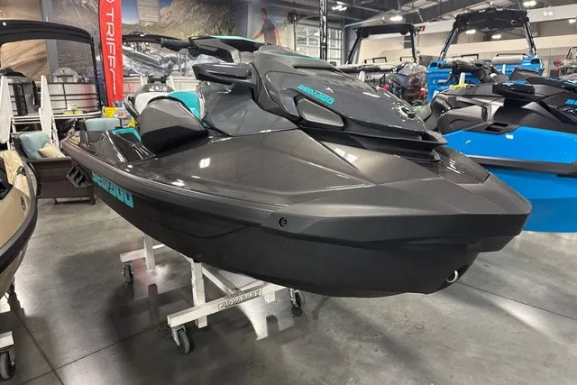 Slide: The Image of A modern Sea-Doo jet ski in a showroom, featuring a sleek, black design. - 2
