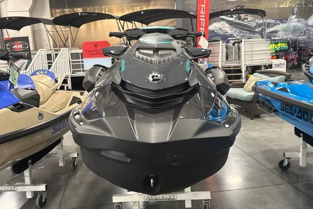 Slide: The Image of A modern Sea-Doo jet ski in a showroom, surrounded by other watercraft. - 22