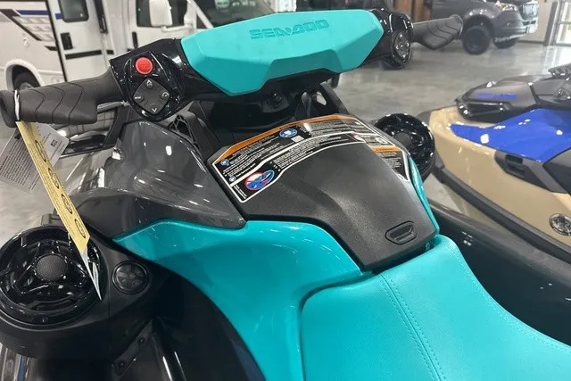 Slide: The Image of A 2026 Sea-Doo PWC GTR 230 with a turquoise seat and black handlebars. - 29
