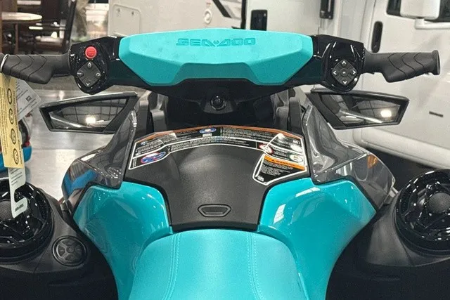 Slide: The Image of Close-up of a Sea-Doo PWC GTR 230 cockpit with blue handlebars and controls. - 34