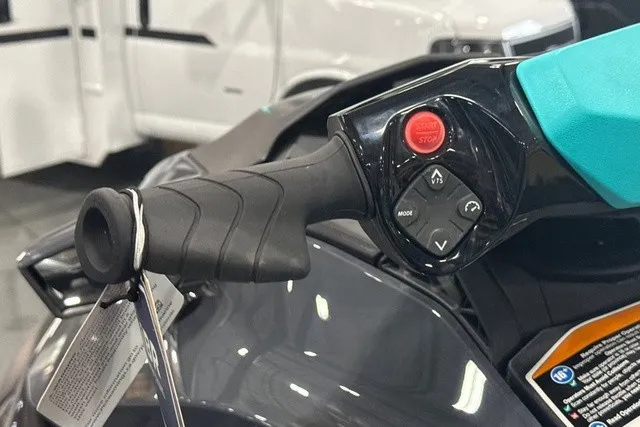 Slide: The Image of Close-up of a Sea-Doo PWC GTR 230 handlebar with control buttons and a key tag. - 16