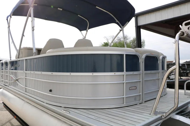 Slide: The Image of 2017 Berkshire 22 E CTS pontoon boat with canopy, docked at marina. - 15