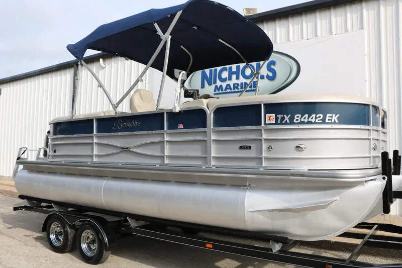 Slide: The Image of 2017 Berkshire 22 E CTS pontoon boat with blue canopy on trailer at Nichols Marine. - 18