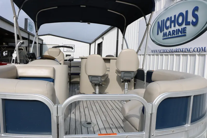 Slide: The Image of 2017 Berkshire 22 E CTS pontoon boat with beige seating at Nichols Marine dealership. - 20