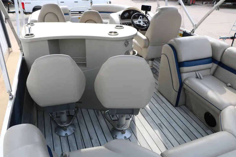 Slide: The Image of 2017 Berkshire 22 E CTS pontoon boat interior with plush seating and modern helm. - 26