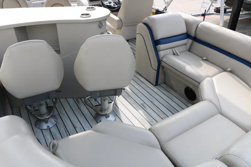 Slide: The Image of Interior of a 2017 Berkshire 22 E CTS pontoon boat with beige seating and wood flooring. - 27
