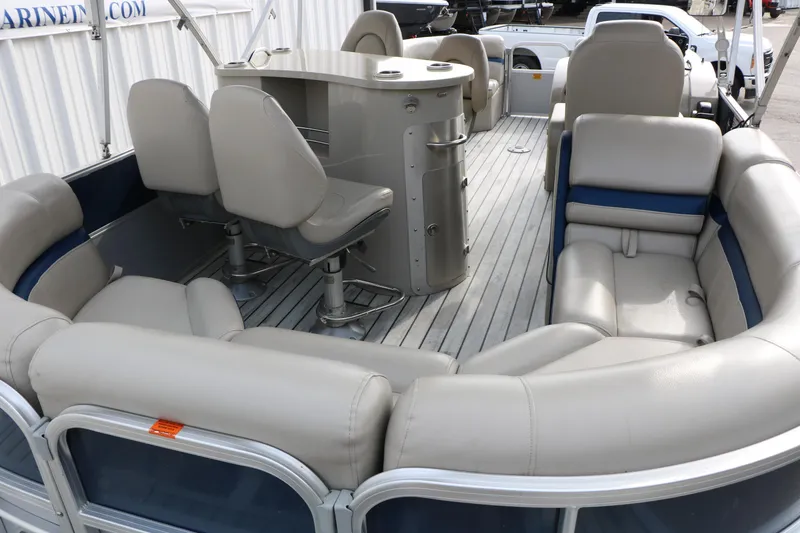 Slide: The Image of 2017 Berkshire 22 E CTS pontoon boat interior with plush seating and helm station. - 28