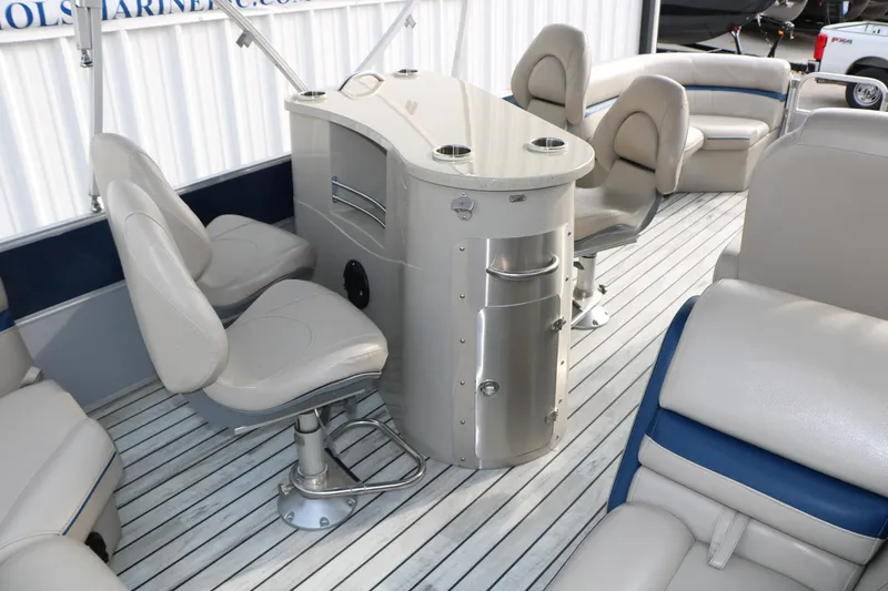 Slide: The Image of Interior of a 2017 Berkshire 22 E CTS pontoon boat with seating and a central console. - 29