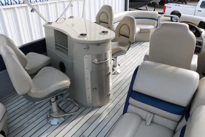 Slide: The Image of Luxurious interior of a 2017 Berkshire 22 E CTS pontoon boat with plush seating and helm. - 30