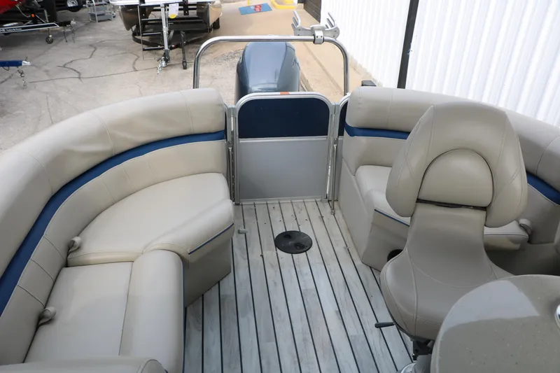 Slide: The Image of 2017 Berkshire 22 E CTS pontoon boat interior with beige seating and wood-style flooring. - 31