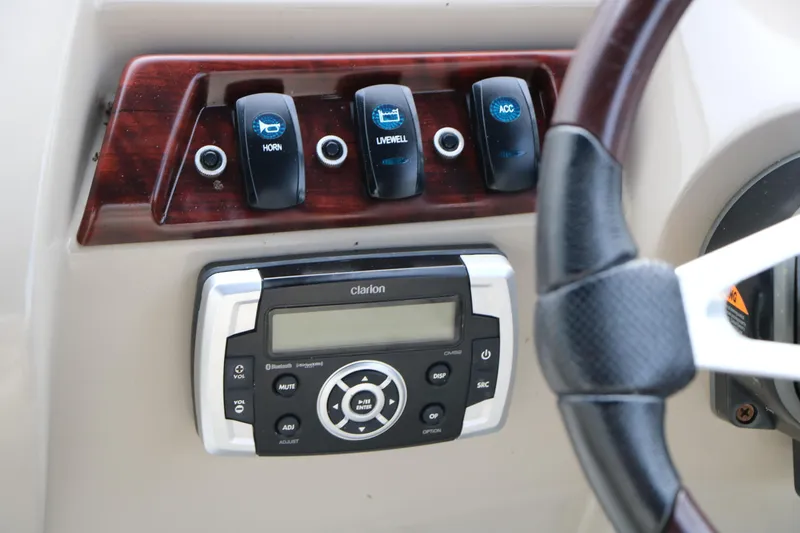 Slide: The Image of Control panel of a 2017 Berkshire 22 E CTS boat with Clarion audio system. - 39