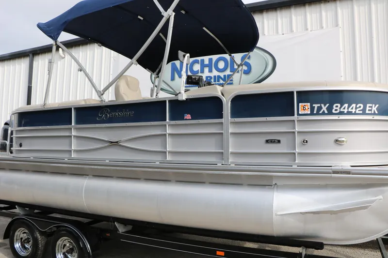 Slide: The Image of 2017 Berkshire 22 E CTS pontoon boat with blue canopy on trailer at Nichols Marine. - 41