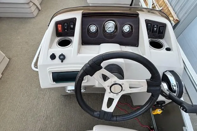 Slide: The Image of Steering console of a 2015 Bennington 24 SLX pontoon boat with gauges and controls. - 6