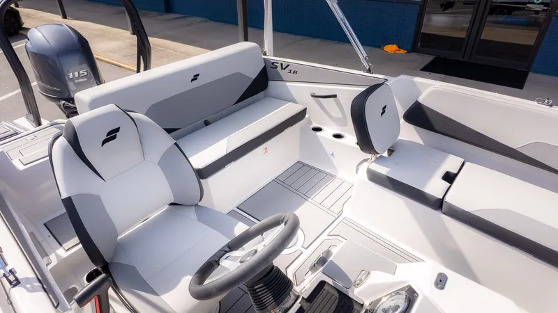 Slide: The Image of Interior of 2026 Starcraft SV 18 OB boat with gray seating. - 11