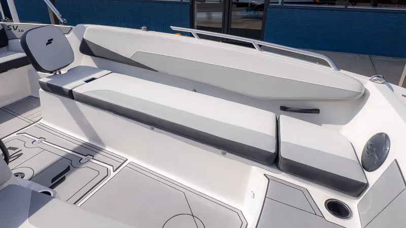 Slide: The Image of Interior of 2026 Starcraft SV 18 OB boat with gray seating. - 12