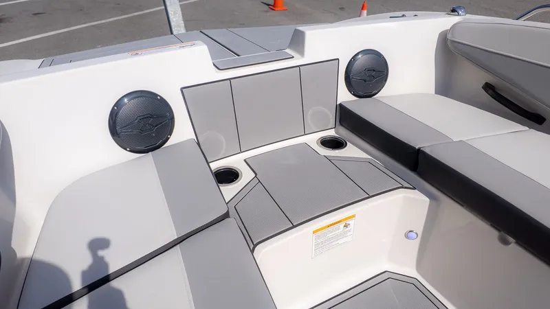 Slide: The Image of Interior of 2026 Starcraft SV 18 OB with speakers and seating. - 18