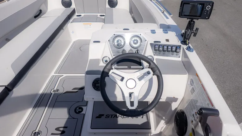 Slide: The Image of Interior view of 2026 Starcraft SV 18 OB boat with steering console. - 22