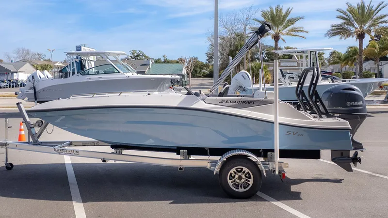 Slide: The Image of Starcraft SV 18 OB 2026 boat parked on trailer outdoors. - 4