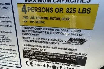 Slide: The Image of 2026 Nitro Z21 XL Pro capacity label, 4 persons or 825 lbs, US Coast Guard compliant. - 9