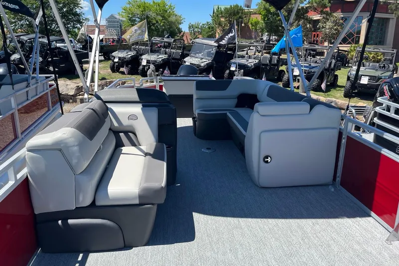 Slide: The Image of 2026 Sun Tracker Fishin' Barge 22 DLX interior with spacious seating and modern design. - 6