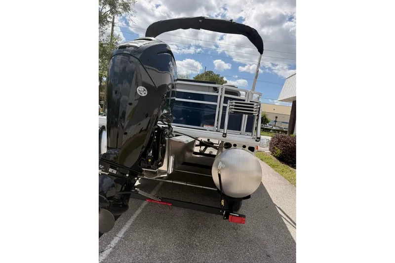 Slide: The Image of 2026 Sun Tracker SportFish 20 DLX pontoon boat with powerful outboard motor. - 97