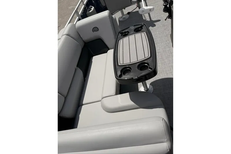 Slide: The Image of 2026 Sun Tracker SportFish 20 DLX interior with seating and table, featuring cup holders. - 101