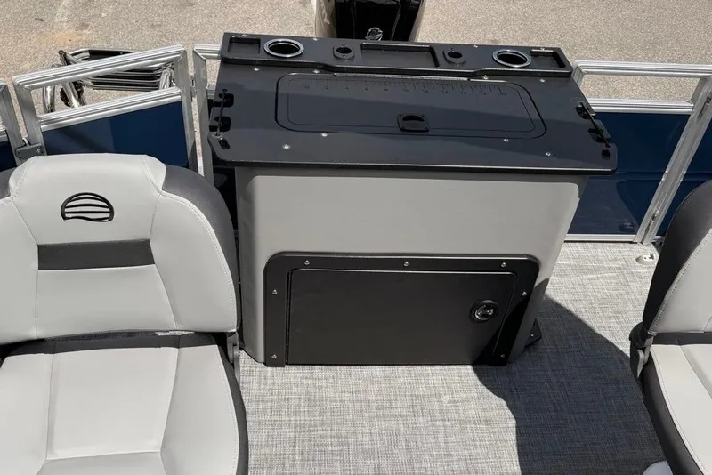 Slide: The Image of 2026 Sun Tracker SportFish 20 DLX interior with seating and storage compartment. - 93
