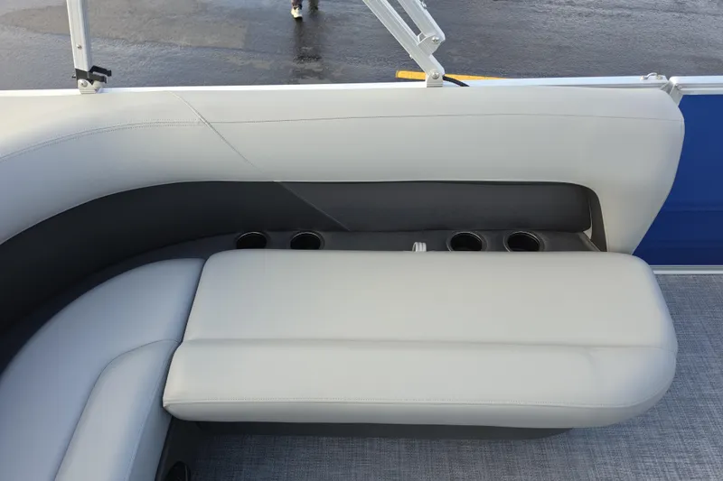 Slide: The Image of 2026 Sun Tracker Party Barge 16 DLX interior seating with cup holders. - 3