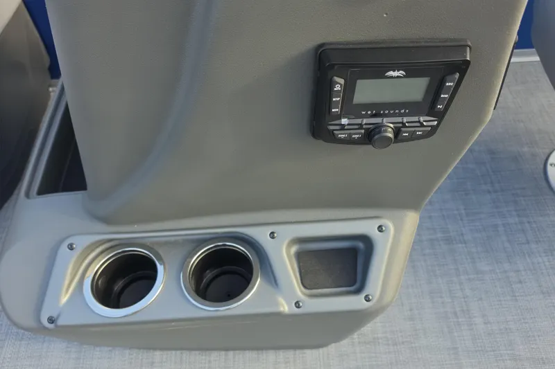 Slide: The Image of 2026 Sun Tracker Party Barge 16 DLX console with stereo system and cup holders. - 6