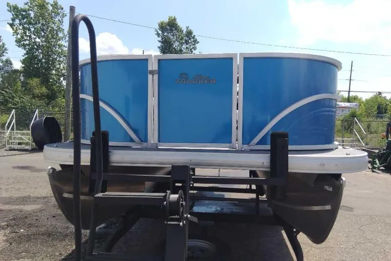 Slide: The Image of 2026 Sun Tracker Party Barge 16 DLX pontoon boat on trailer, blue exterior. - 5