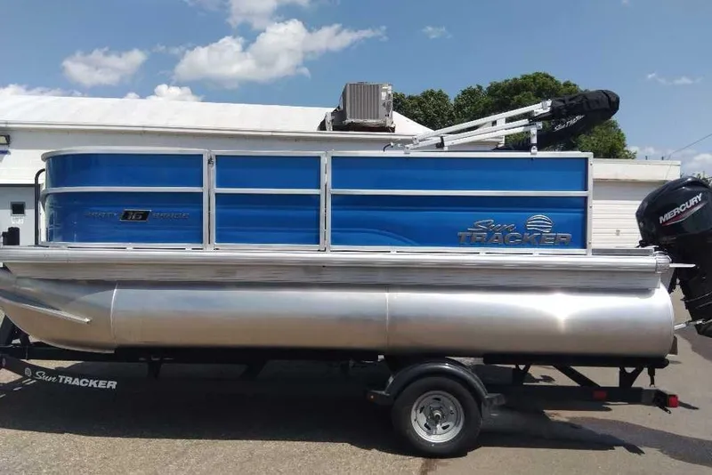 Slide: The Image of 2026 Sun Tracker Party Barge 16 DLX pontoon boat with Mercury outboard motor. - 4