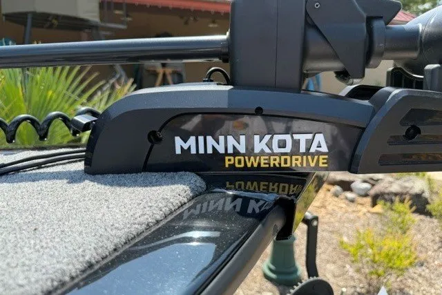 Slide: The Image of Minn Kota PowerDrive on 2025 Tracker Super Guide V-16 T boat, outdoor setting. - 12