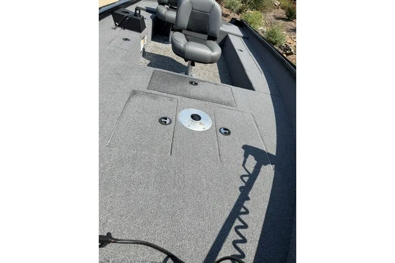 Slide: The Image of 2025 Tracker Super Guide V-16 T boat interior with seating and storage compartments. - 11