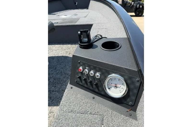 Slide: The Image of Control panel of 2025 Tracker Super Guide V-16 T boat with gauges and switches. - 6