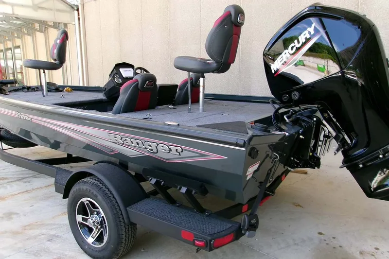 Slide: The Image of 2026 Ranger RT178C fishing boat with Mercury outboard motor, parked on trailer. - 2