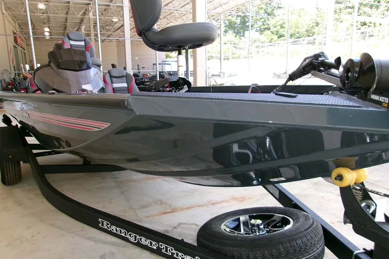 Slide: The Image of 2026 Ranger RT178C fishing boat on trailer in showroom. - 1