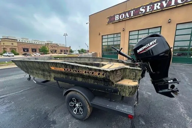 The Image of 2026 Tracker Grizzly 1756 T Marsh boat with Mercury engine outside a boat service center. - 0