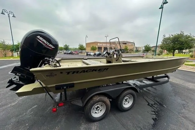 The Image of 2026 Tracker Grizzly 2072 CC boat on trailer, featuring Mercury outboard motor. - 0