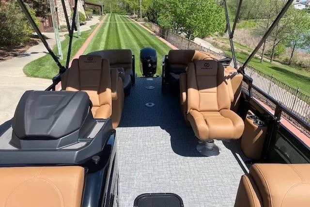 Slide: The Image of 2026 Regency 230 DL boat interior with luxurious tan seating and spacious layout. - 3