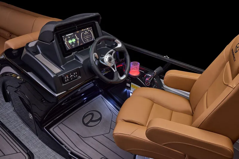 Slide: The Image of Luxurious 2026 Regency 230 DL boat interior with advanced dashboard and plush seating. - 33