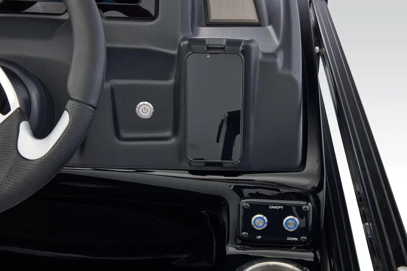 Slide: The Image of Dashboard of 2026 Regency 230 DL boat with steering wheel and control buttons. - 34