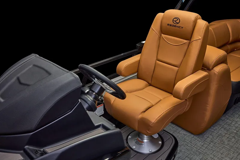 Slide: The Image of Luxurious tan captain's chair in 2026 Regency 230 DL boat, featuring ergonomic design and premium materials. - 35