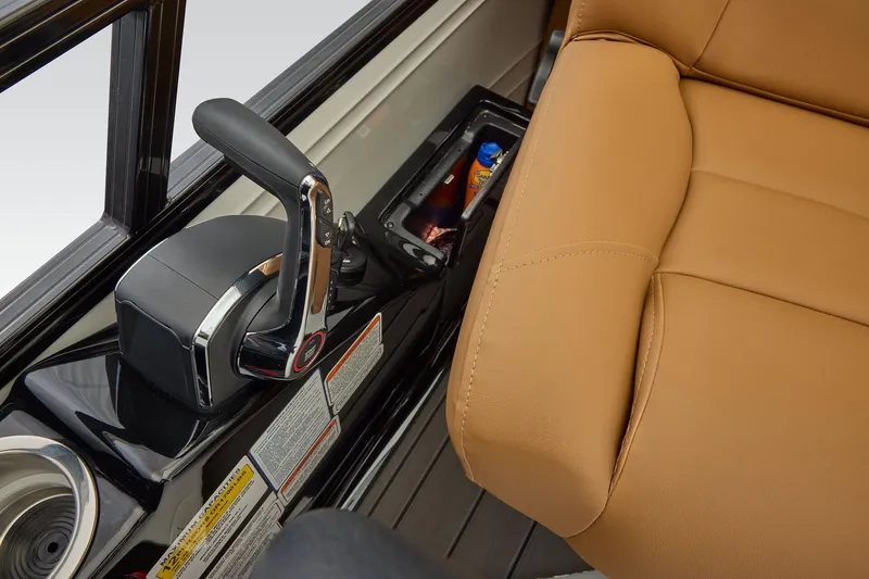 Slide: The Image of Regency 230 DL 2026 boat interior with throttle control and tan seating. - 36