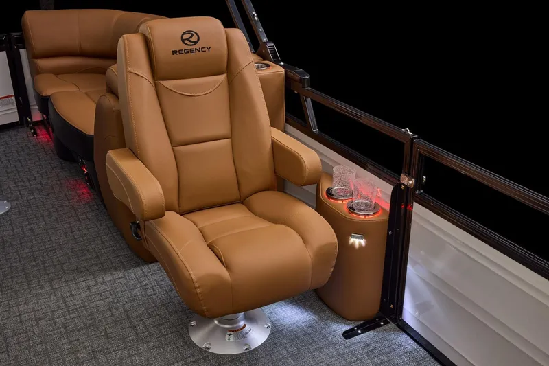 Slide: The Image of Luxurious seating on 2026 Regency 230 DL boat with cup holders and ambient lighting. - 37