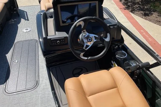 Slide: The Image of 2026 Regency 230 DL boat interior with steering wheel and touchscreen display. - 4