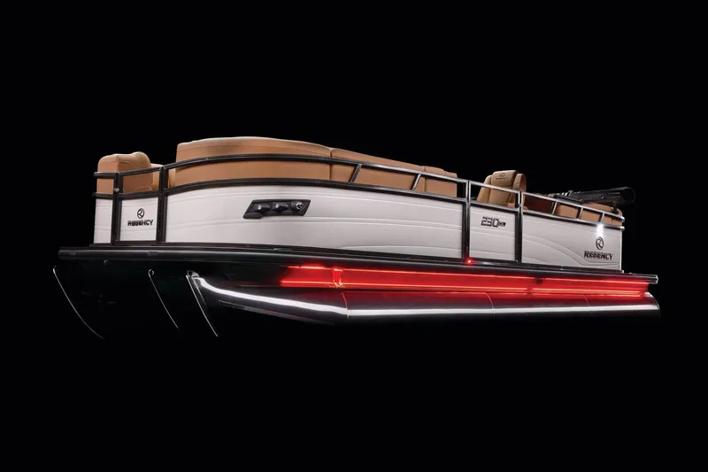 Slide: The Image of 2026 Regency 230 DL pontoon boat with sleek design and illuminated underglow lighting. - 48