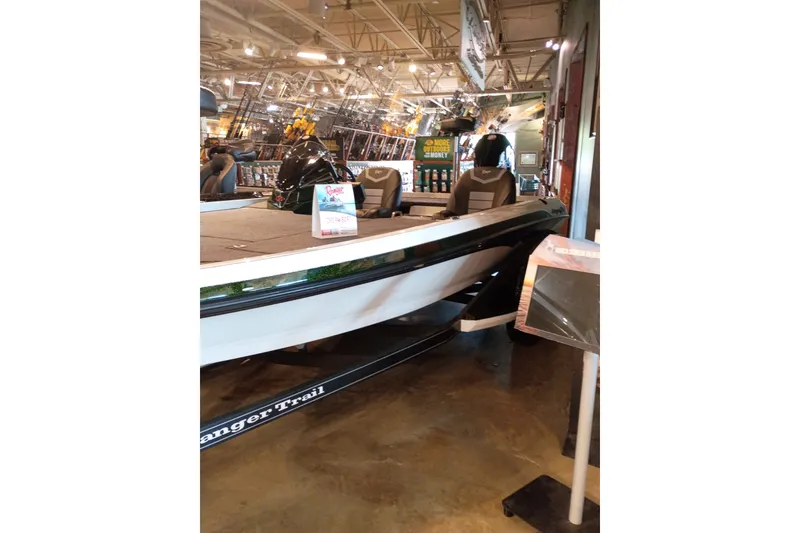 Slide: The Image of 2026 Ranger Z520 boat displayed indoors with promotional signage. - 9