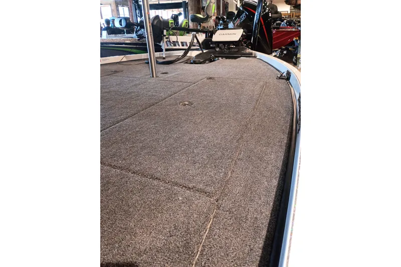 Slide: The Image of 2026 Ranger Z520 boat deck with carpeted surface and mounted Garmin equipment. - 8