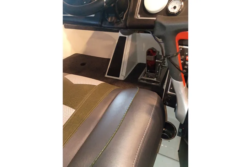 Slide: The Image of 2026 Ranger Z520 boat interior with steering wheel, seat, and control panel. - 1